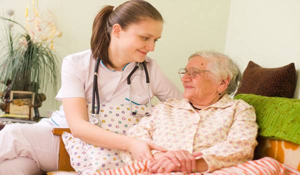 Helping a sick elderly woman